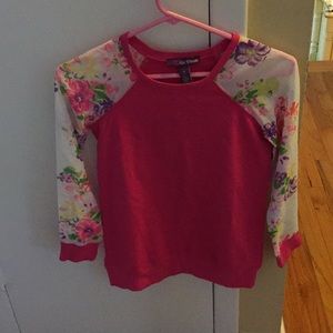 A hot pink, floral long sleeve tee shirt.